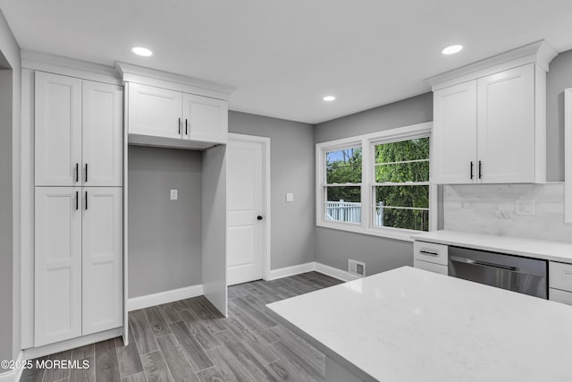 92 Sargent Rd, Freehold, NJ 07728 - kitchen featuring stainless steel dishwasher, light countertops, recessed lighting, white cabinetry, and baseboards