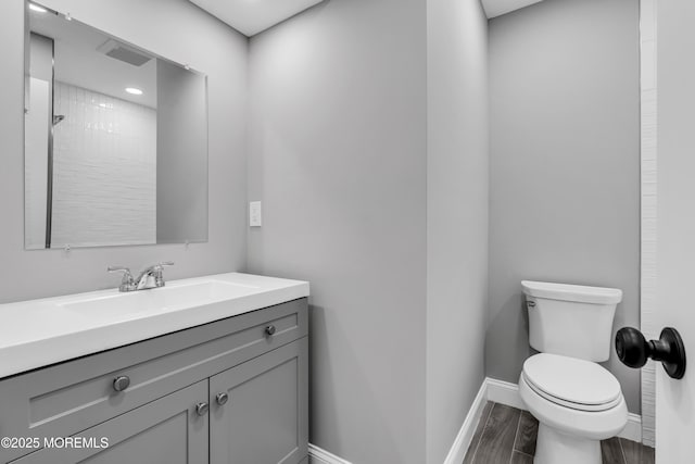 92 Sargent Rd, Freehold, NJ 07728 - bathroom featuring toilet, baseboards, and vanity