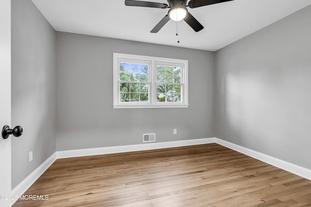 92 Sargent Rd, Freehold, NJ 07728 - empty room with wood finished floors, a ceiling fan, and baseboards