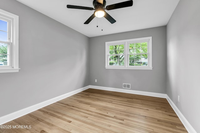 92 Sargent Rd, Freehold, NJ 07728 - empty room with healthy amount of natural light, baseboards, and light wood finished floors