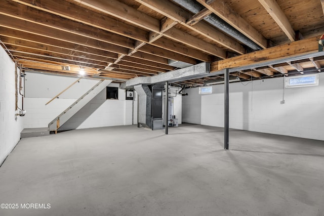 92 Sargent Rd, Freehold, NJ 07728 - below grade area featuring stairs, heating unit, and gas water heater