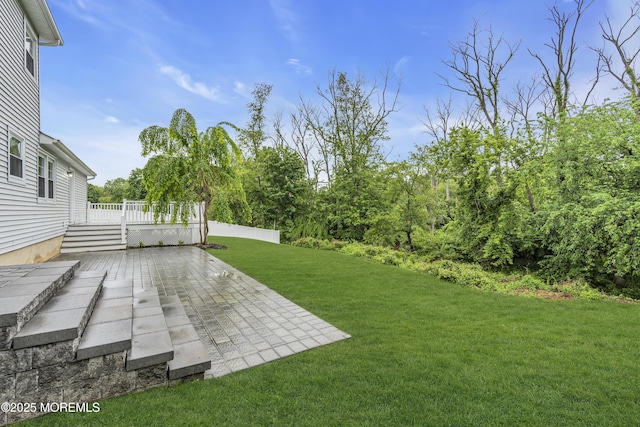 92 Sargent Rd, Freehold, NJ 07728 - view of green lawn with a patio and a deck