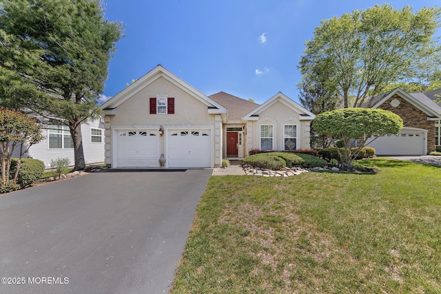 7 Spring Lake Ct, Barnegat, NJ 08005 - view of front facade with asphalt driveway, stucco siding, and a front yard