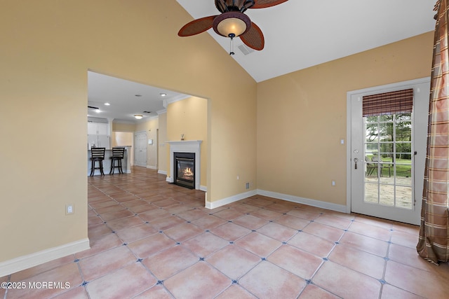 7 Spring Lake Ct, Barnegat, NJ 08005 - unfurnished living room with ceiling fan, high vaulted ceiling, baseboards, light tile patterned flooring, and a glass covered fireplace
