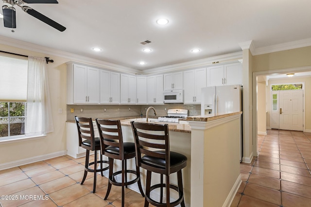7 Spring Lake Ct, Barnegat, NJ 08005 - kitchen featuring white appliances, a ceiling fan, tasteful backsplash, light tile patterned floors, and crown molding