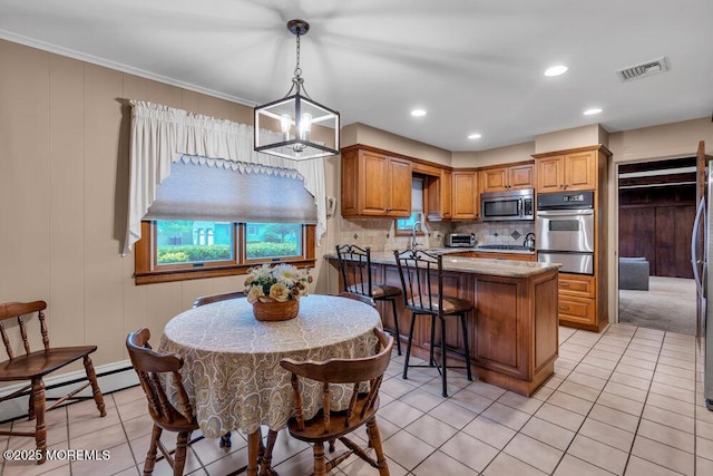 dining space featuring light tile patterned flooring and a chandelier