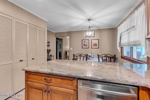 kitchen with brown cabinetry, light stone counters, crown molding, and pendant lighting