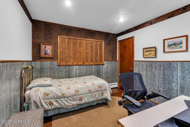 bedroom featuring wainscoting, a baseboard radiator, an office area, and recessed lighting