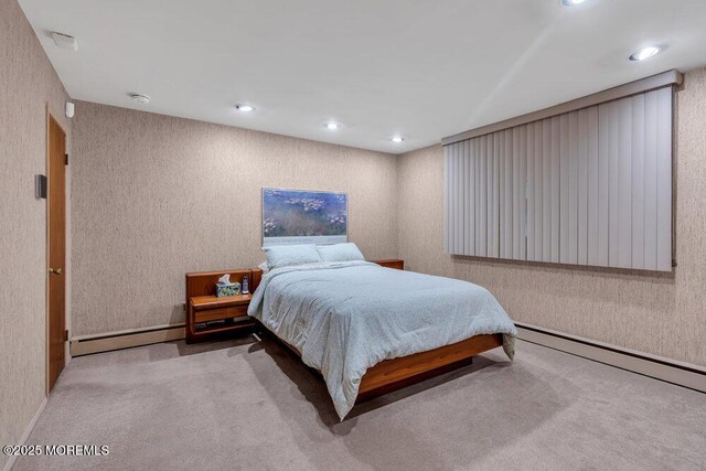 bedroom featuring a baseboard radiator, carpet flooring, and recessed lighting