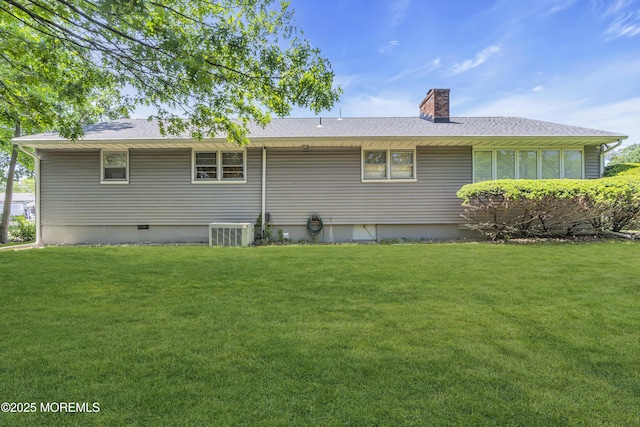 2308 Logan Rd, Ocean Twp, NJ 07712 - back of property featuring a lawn, a chimney, central AC, and roof with shingles