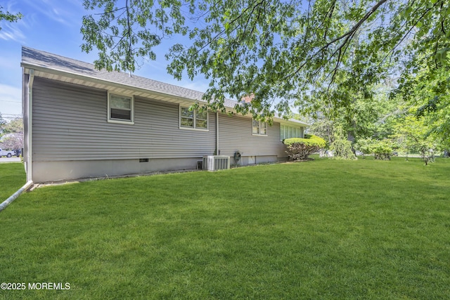 2308 Logan Rd, Ocean Twp, NJ 07712 - view of property exterior featuring a lawn, central air condition unit, and roof with shingles