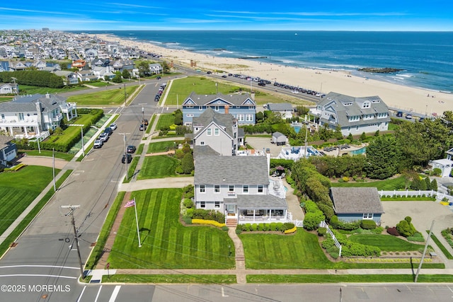bird's eye view of waterfront with a beach
