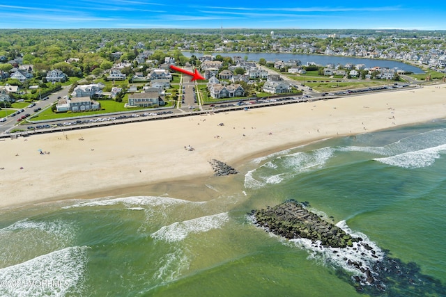aerial view of residential area with unending shoreline