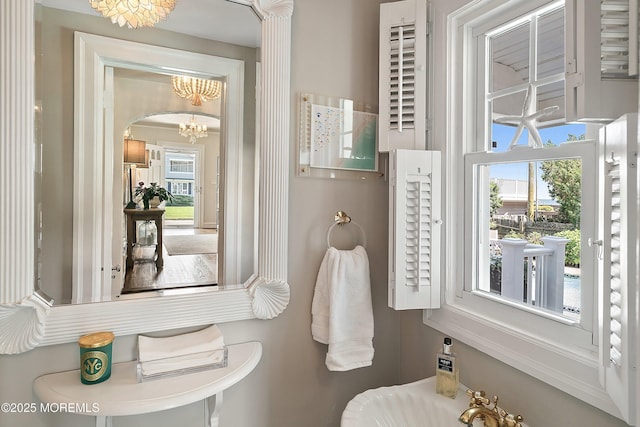 bathroom featuring a chandelier