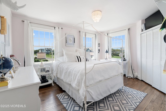 bedroom featuring dark wood-style flooring