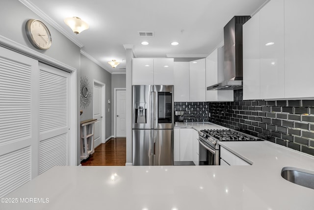 7 Samantha Dr, Tinton Falls, NJ 07712 - kitchen with appliances with stainless steel finishes, wall chimney range hood, modern cabinets, white cabinets, and light countertops