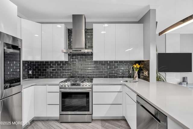 7 Samantha Dr, Tinton Falls, NJ 07712 - kitchen with stainless steel appliances, modern cabinets, crown molding, wall chimney exhaust hood, and a sink