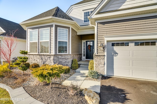 22 Keeneland Rd, New Egypt, NJ 08533 - entrance to property with a garage, stone siding, and roof with shingles