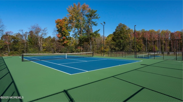 22 Keeneland Rd, New Egypt, NJ 08533 - view of tennis court with fence, community basketball court, and a view of trees