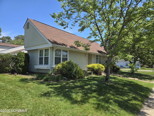 439D Chesterfield Ct, Manchester, NJ 08759 - view of side of home featuring a lawn and a shingled roof