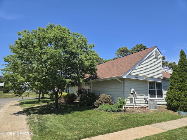 439D Chesterfield Ct, Manchester, NJ 08759 - view of front of home featuring a front lawn, roof with shingles, and central AC unit