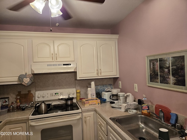 439D Chesterfield Ct, Manchester, NJ 08759 - kitchen with under cabinet range hood, electric range, a sink, a ceiling fan, and backsplash
