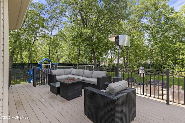 821 Woodland Dr, Lakewood, NJ 08701 - deck with an outdoor living space with a fire pit, a playground, and view of scattered trees