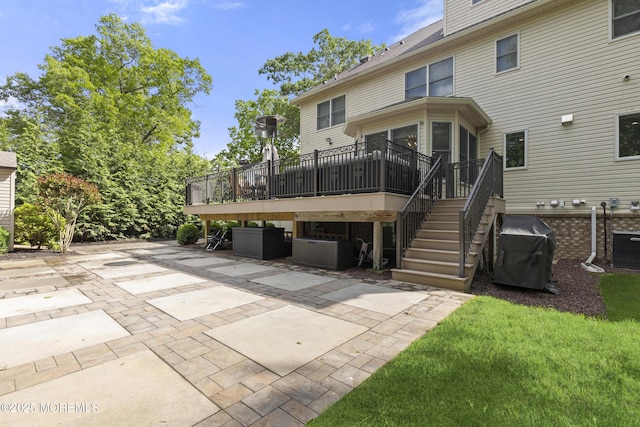821 Woodland Dr, Lakewood, NJ 08701 - back of property with a patio and a deck