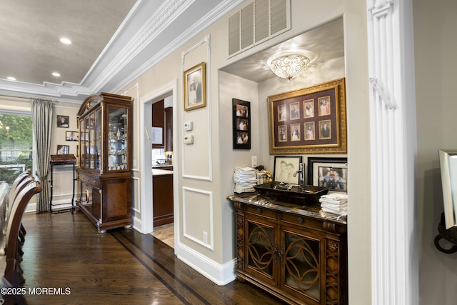 821 Woodland Dr, Lakewood, NJ 08701 - corridor featuring dark wood finished floors, crown molding, a chandelier, recessed lighting, and a raised ceiling