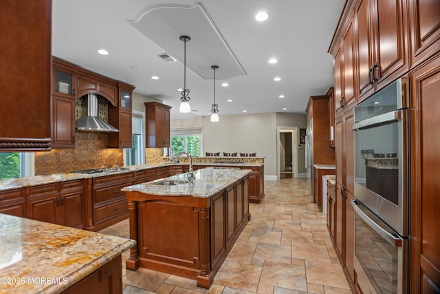 821 Woodland Dr, Lakewood, NJ 08701 - kitchen featuring wall chimney exhaust hood, appliances with stainless steel finishes, stone tile floors, a sink, and recessed lighting