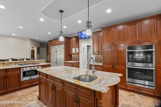 821 Woodland Dr, Lakewood, NJ 08701 - kitchen featuring stainless steel appliances, a sink, a center island with sink, light stone countertops, and recessed lighting