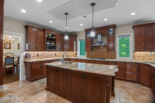821 Woodland Dr, Lakewood, NJ 08701 - kitchen with stainless steel appliances, wall chimney exhaust hood, plenty of natural light, a sink, and recessed lighting