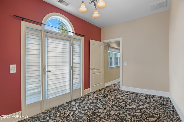 821 Woodland Dr, Lakewood, NJ 08701 - spare room with carpet, a chandelier, and baseboards