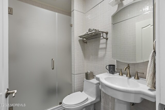 821 Woodland Dr, Lakewood, NJ 08701 - full bath with toilet, decorative backsplash, a shower stall, a sink, and tile walls