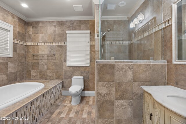 821 Woodland Dr, Lakewood, NJ 08701 - full bath featuring tile walls, crown molding, toilet, vanity, and a garden tub