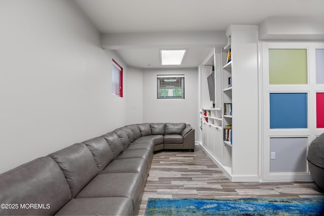 821 Woodland Dr, Lakewood, NJ 08701 - living area featuring light wood finished floors, baseboards, and built in shelves