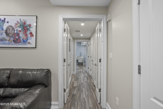 821 Woodland Dr, Lakewood, NJ 08701 - hallway featuring wood finished floors and baseboards