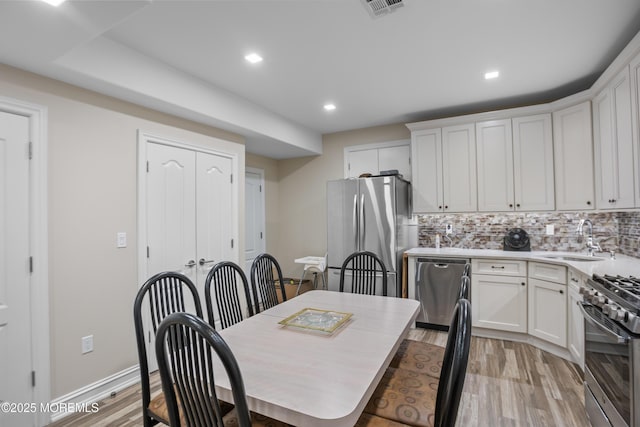821 Woodland Dr, Lakewood, NJ 08701 - dining space featuring recessed lighting and light wood finished floors