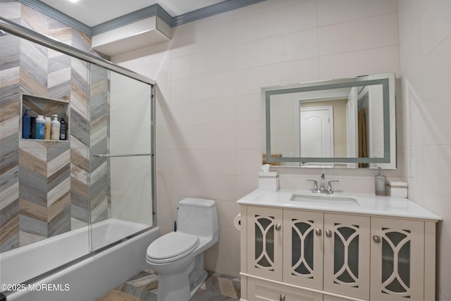 821 Woodland Dr, Lakewood, NJ 08701 - bathroom featuring tile walls, toilet, bath / shower combo with glass door, and vanity