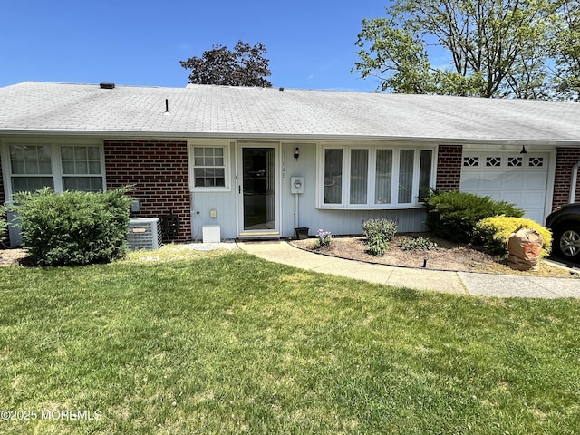 1164B Argyll Cir, Lakewood, NJ 08701 - single story home with an attached garage, a front yard, brick siding, and a shingled roof