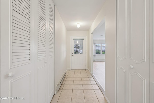 1164B Argyll Cir, Lakewood, NJ 08701 - hallway with a baseboard radiator and light tile patterned flooring