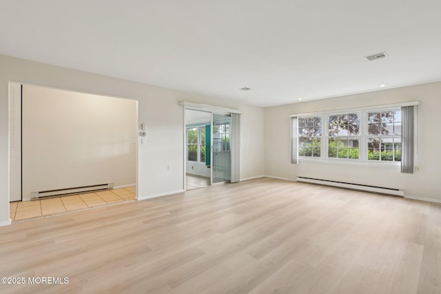 1164B Argyll Cir, Lakewood, NJ 08701 - empty room with baseboard heating, a baseboard heating unit, healthy amount of natural light, light wood-style flooring, and recessed lighting