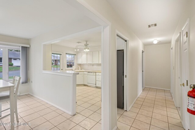 1164B Argyll Cir, Lakewood, NJ 08701 - hallway with light tile patterned flooring and plenty of natural light