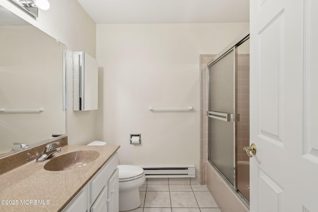 1164B Argyll Cir, Lakewood, NJ 08701 - bathroom featuring baseboard heating, vanity, tile patterned floors, and combined bath / shower with glass door