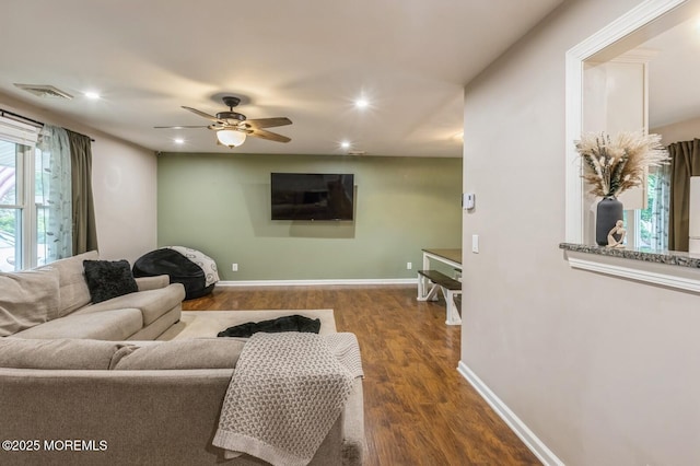 living room with wood finished floors, a ceiling fan, recessed lighting, and baseboards