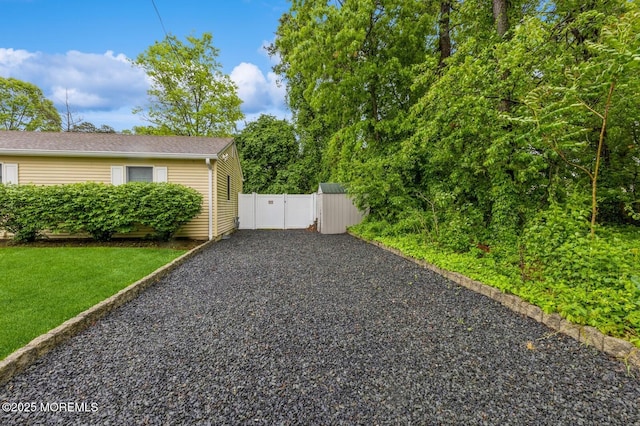 view of property exterior with gravel driveway