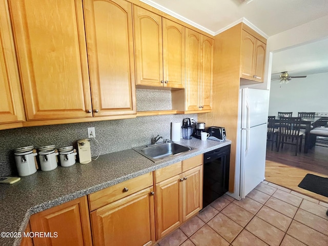 kitchen with dishwasher, freestanding refrigerator, a sink, a ceiling fan, and light tile patterned flooring