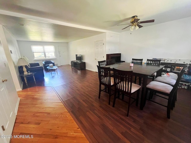 dining area with wood finished floors and ceiling fan