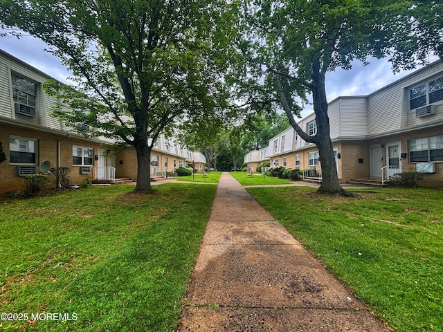 surrounding community featuring a yard and a residential view