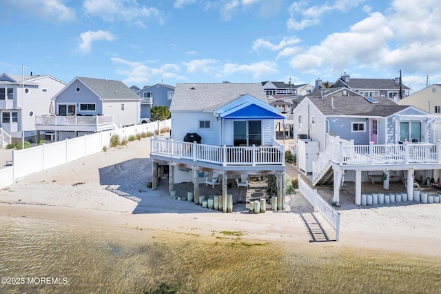 433 Bayside Ter Unit 1, Seaside Heights, NJ 08751 - back of house with a residential view, a wooden deck, a fenced backyard, and roof with shingles